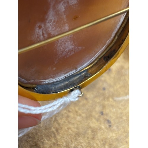 115 - A 19th century Italian cameo brooch, the central oval depiction of the Madonna with child, within a ... 