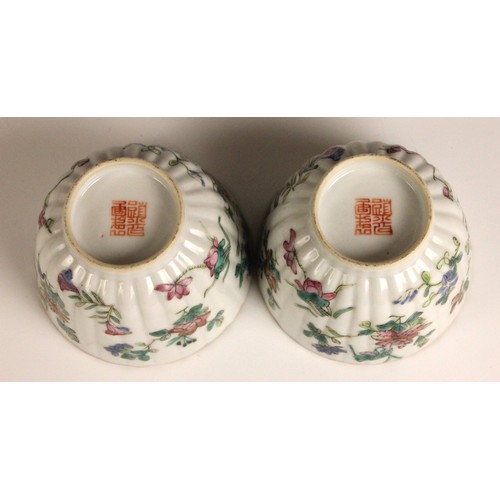 362 - A pair of Chinese porcelain tea bowls, Guangxu (1875–1908), each of fluted circular form and painted... 