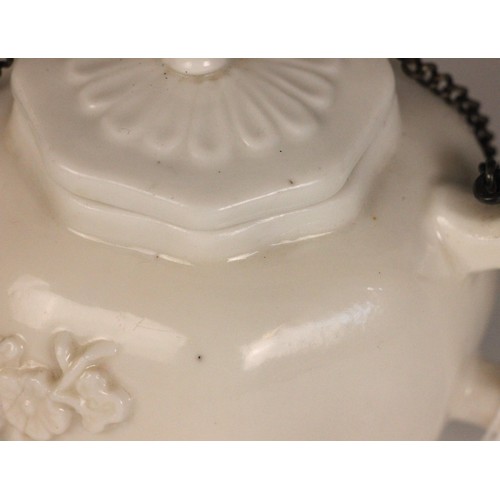 359 - A Chinese blanc de chine teapot and cover, 18th century, the globular octagonal shaped teapot with p... 