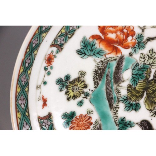 339 - A Chinese porcelain famille verte saucer dish, 18th century, the small circular dish painted to the ... 
