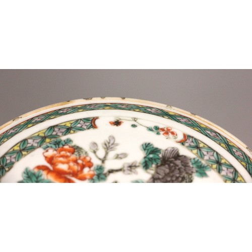 339 - A Chinese porcelain famille verte saucer dish, 18th century, the small circular dish painted to the ... 
