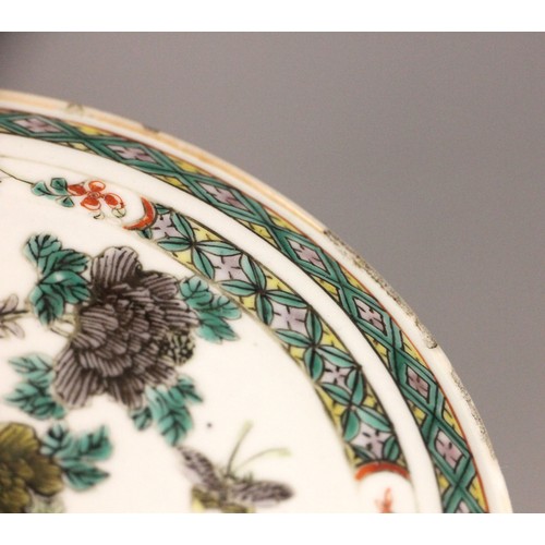 339 - A Chinese porcelain famille verte saucer dish, 18th century, the small circular dish painted to the ... 