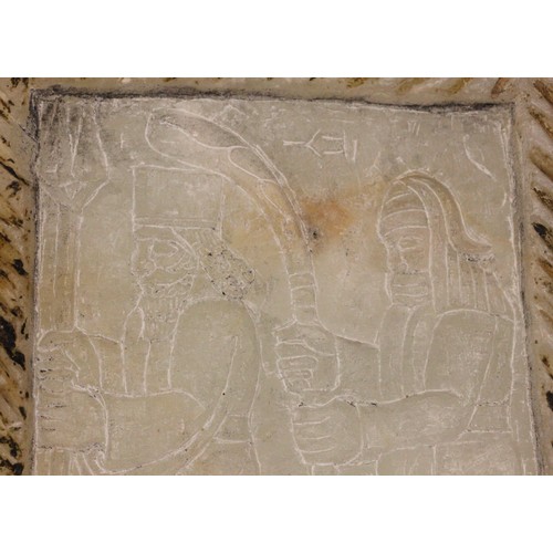 363 - A Western Asiatic carved soapstone stele, Mesopotamia, carved with two Assyrian gods, the reverse ca... 