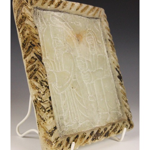 363 - A Western Asiatic carved soapstone stele, Mesopotamia, carved with two Assyrian gods, the reverse ca... 