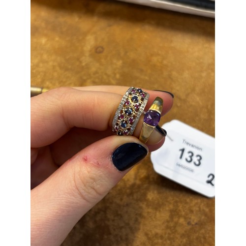 133 - A 9ct gold amethyst dress ring, the tension set amethyst within tapering yellow metal shank, import ... 