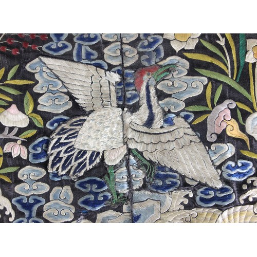 411 - A 19th century Chinese silk embroidered civil rank badge, embroidered to the centre with an egret, e... 