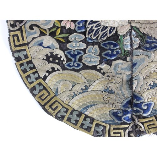 411 - A 19th century Chinese silk embroidered civil rank badge, embroidered to the centre with an egret, e... 