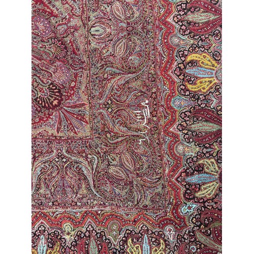 398 - A 19th century finely woven Kashmir style paisley shawl, in ivory with a paisley pattern border, fri... 