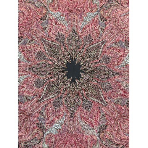 398 - A 19th century finely woven Kashmir style paisley shawl, in ivory with a paisley pattern border, fri... 