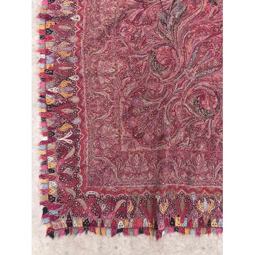 398 - A 19th century finely woven Kashmir style paisley shawl, in ivory with a paisley pattern border, fri... 