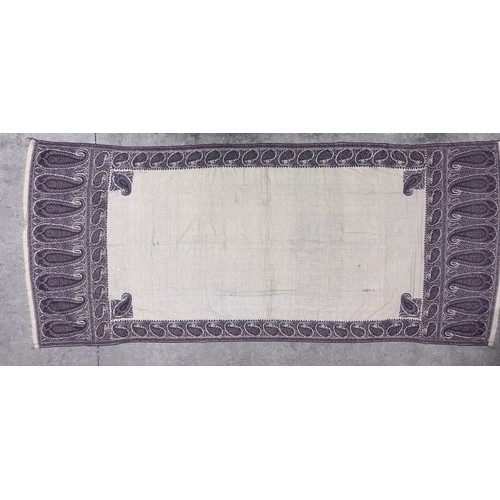 398 - A 19th century finely woven Kashmir style paisley shawl, in ivory with a paisley pattern border, fri... 
