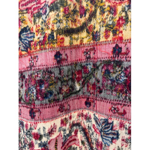 399 - A 19th century finely woven Kashmir style shawl, the ivory ground with delicate foliate borders and ... 