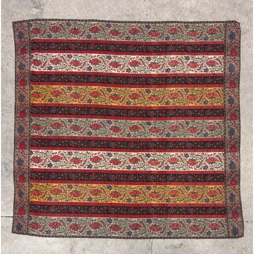 399 - A 19th century finely woven Kashmir style shawl, the ivory ground with delicate foliate borders and ... 