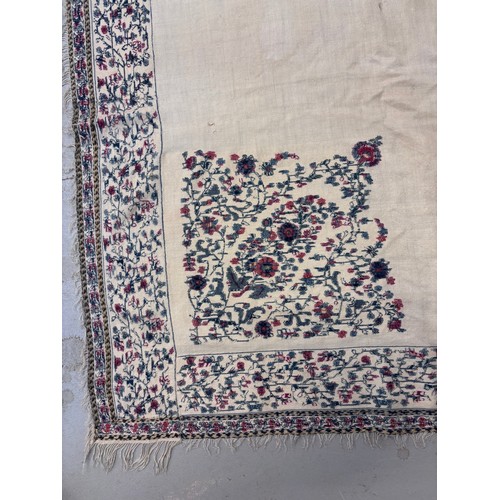 399 - A 19th century finely woven Kashmir style shawl, the ivory ground with delicate foliate borders and ... 