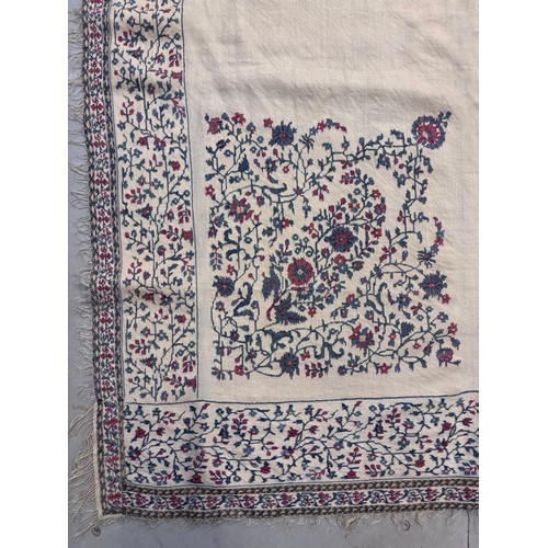 399 - A 19th century finely woven Kashmir style shawl, the ivory ground with delicate foliate borders and ... 