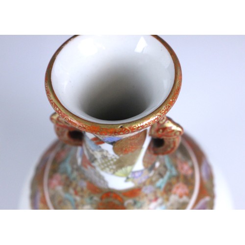 353 - A Japanese porcelain Kutani vase, Meiji Period (1868-1912), the bottle shaped vase with two zoomorph... 