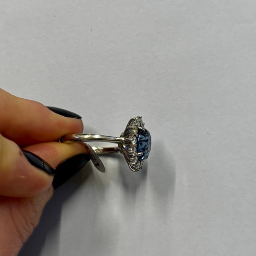 135 - A mid 20th century certified sapphire and diamond cluster ring, circa 1960, the oval sapphire within... 