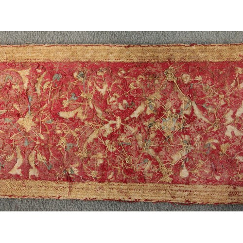 405 - A 19th century green silk damask and metallic edged apron, on yellow fabric backing, 116cm long, wit... 