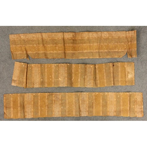 409 - An Indian gauze bandhani sari panel, embroidered with repeating geometric gulls against a red ground... 