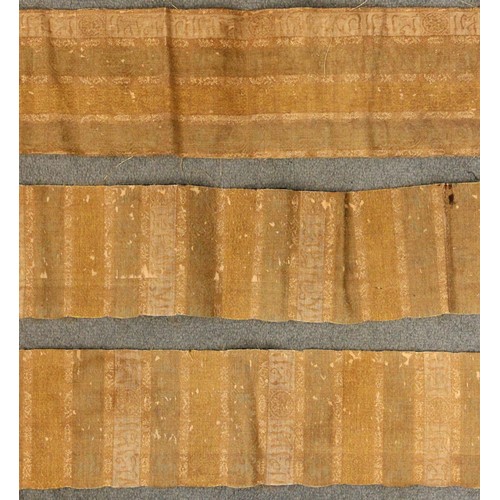 409 - An Indian gauze bandhani sari panel, embroidered with repeating geometric gulls against a red ground... 