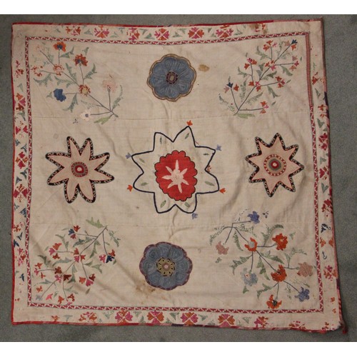 402 - A Suzani needlework panel, Uzbekistan 20th century, of square section embroidered with geometric flo... 