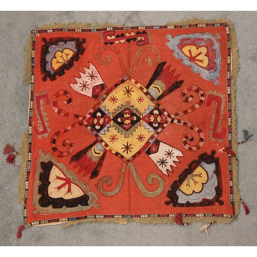 402 - A Suzani needlework panel, Uzbekistan 20th century, of square section embroidered with geometric flo... 