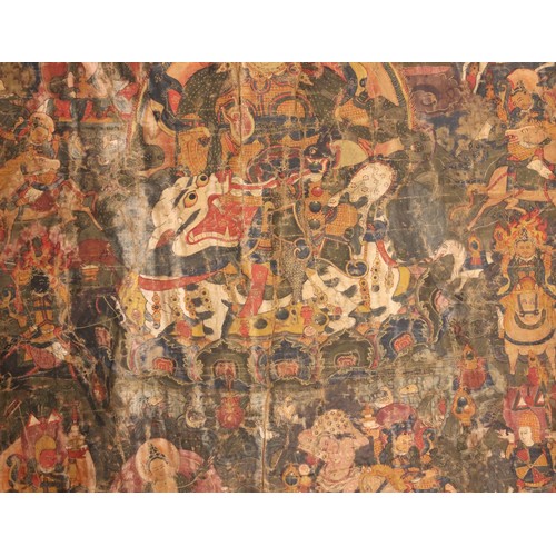 415 - A South East Asian Tibetan Thangka, 19th century, painted in gouache against a silk and metallic gro... 