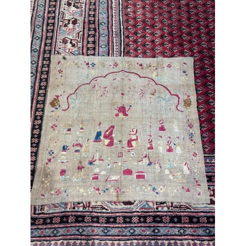 408 - A 19th century Chinese silk embroidered panel, depicting a sage and attendant beneath fruiting gourd... 