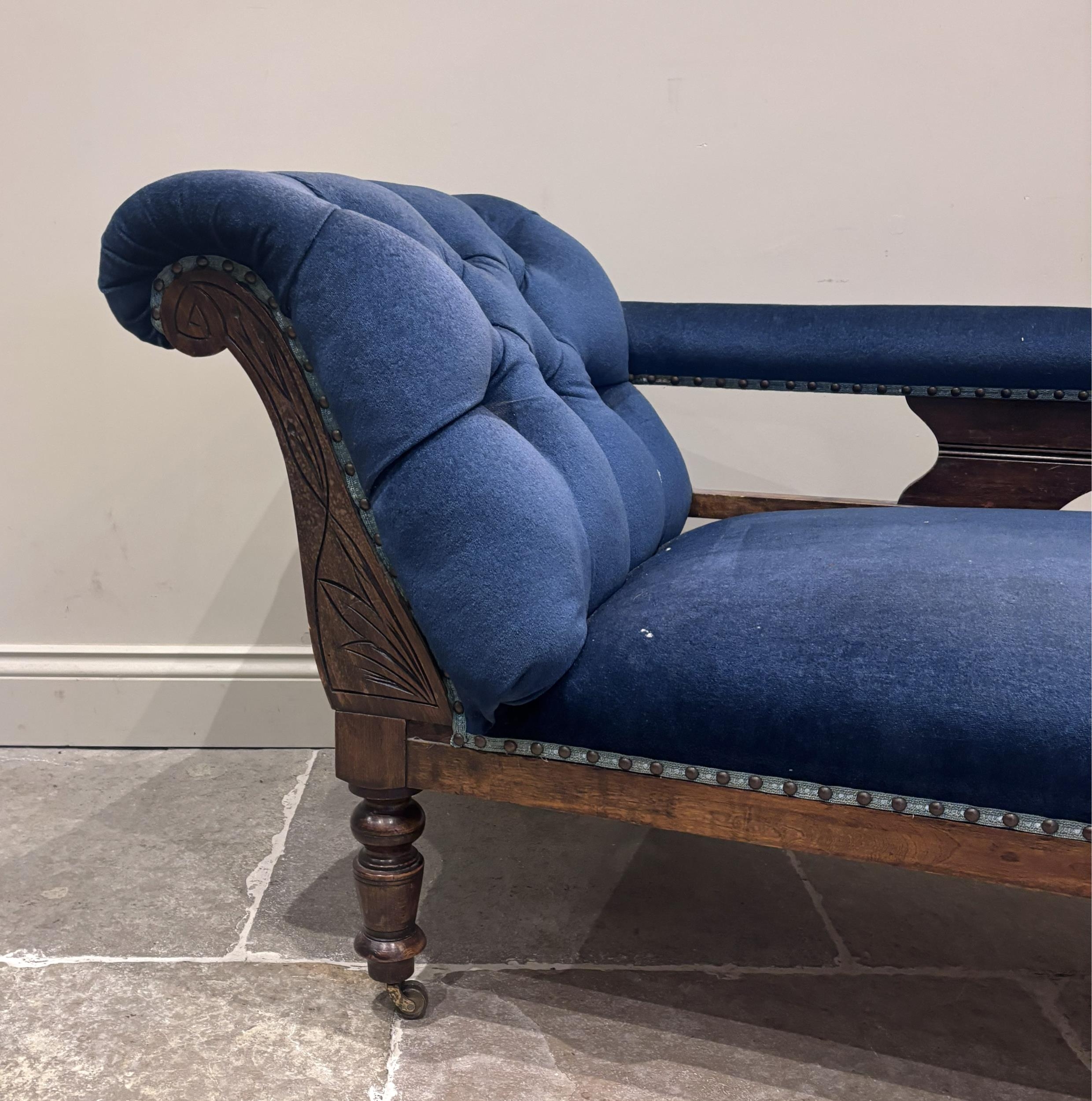 A late 19th century walnut and blue velour upholstered chaise longue ...