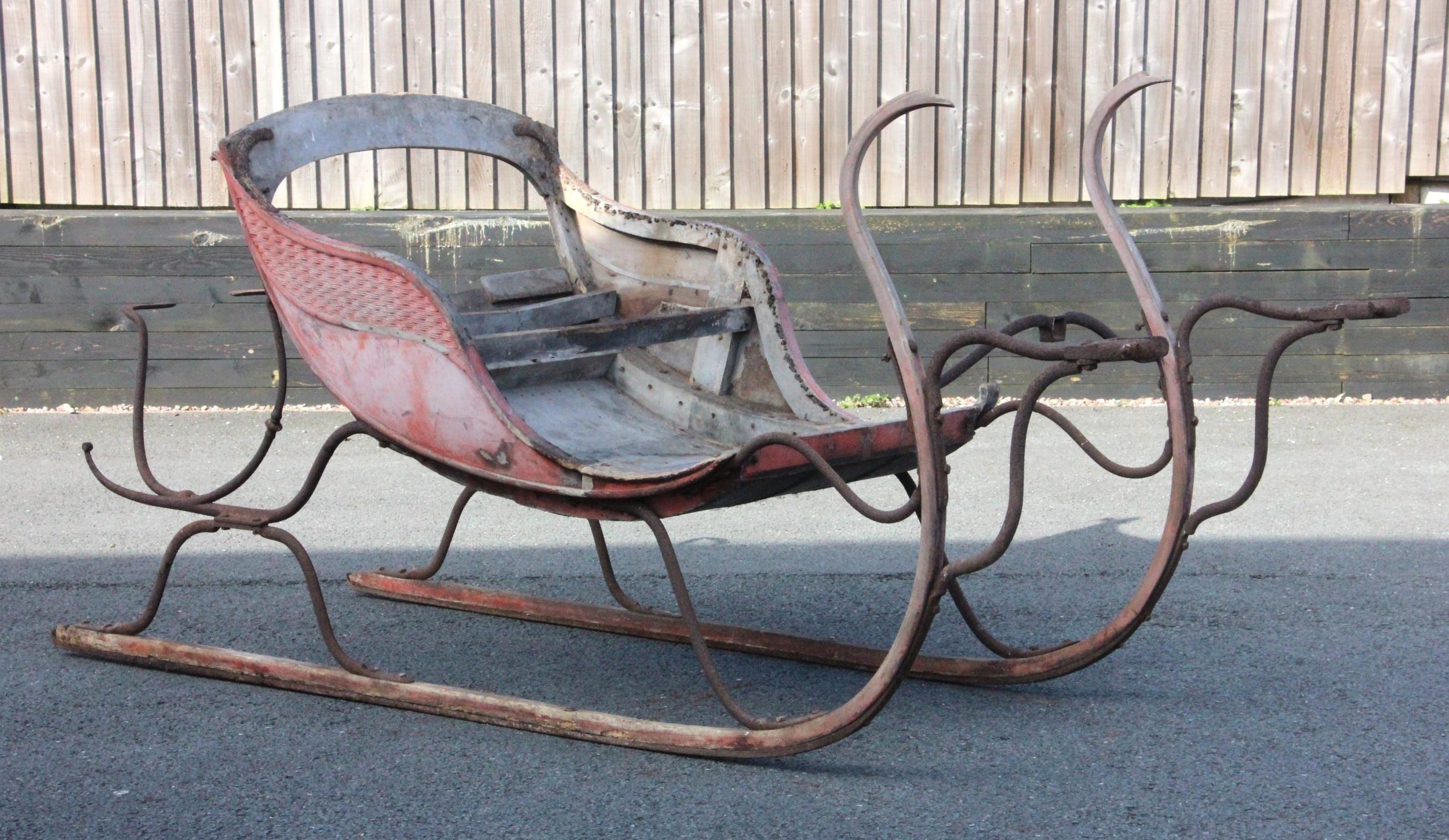 A horse drawn two seat sleigh, believed to be early 19th century, of ...