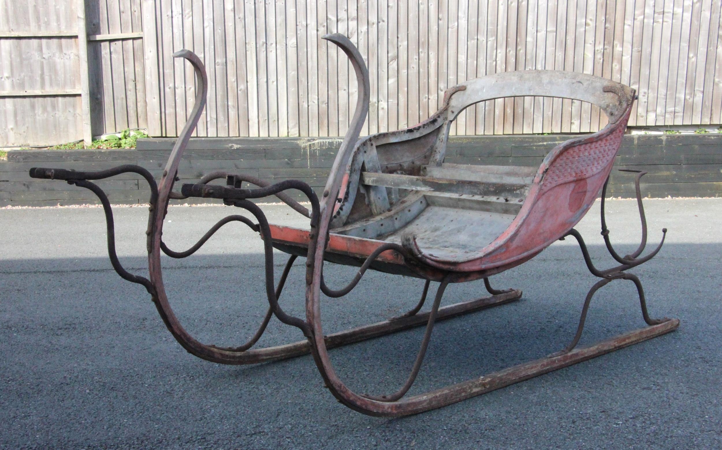 A horse drawn two seat sleigh, believed to be early 19th century, of ...