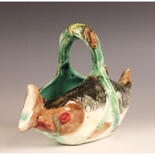 411 - An English Majolica fish basket, 19th century, modelled as two fish joined by a seaweed handle, 23cm... 
