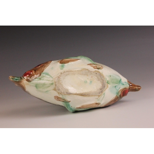 411 - An English Majolica fish basket, 19th century, modelled as two fish joined by a seaweed handle, 23cm... 