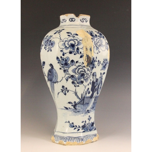 438 - An 18th century blue and white Delft vase, the high shouldered vase of octagonal baluster form exter... 
