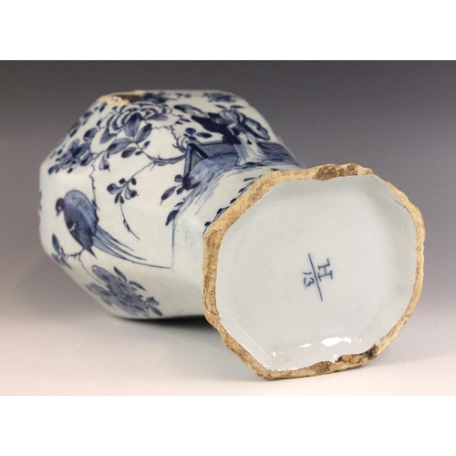 438 - An 18th century blue and white Delft vase, the high shouldered vase of octagonal baluster form exter... 