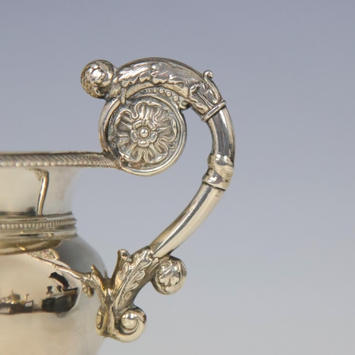 82 - A late 19th century white metal twin handled bowl, possibly Danish, the twin florally cast handles a... 