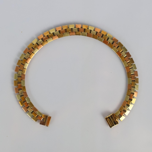 176 - A late 20th century three tone bracelet, the brick link style bracelet with textured design, hidden ... 