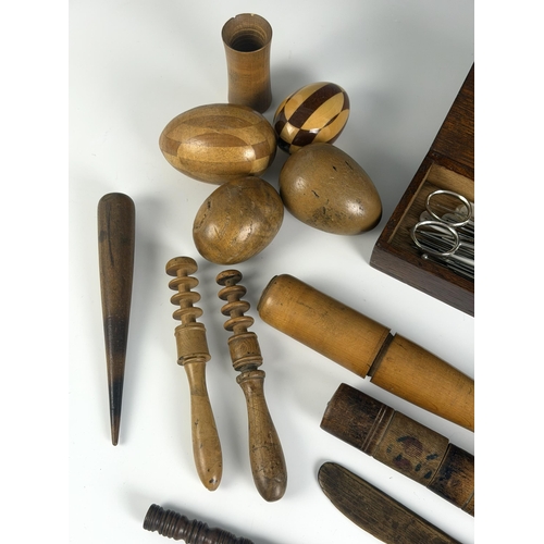 A collection of treen and other needlework tools and equipment, to ...