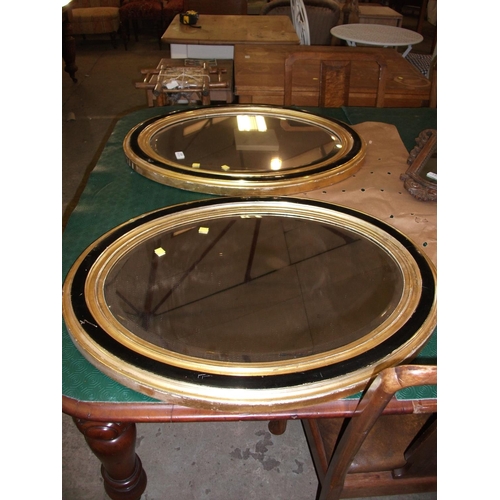 129 - PAIR OF OVAL MIRRORS (GILT & BLACK FRAMES) 29''H X 23.5''L