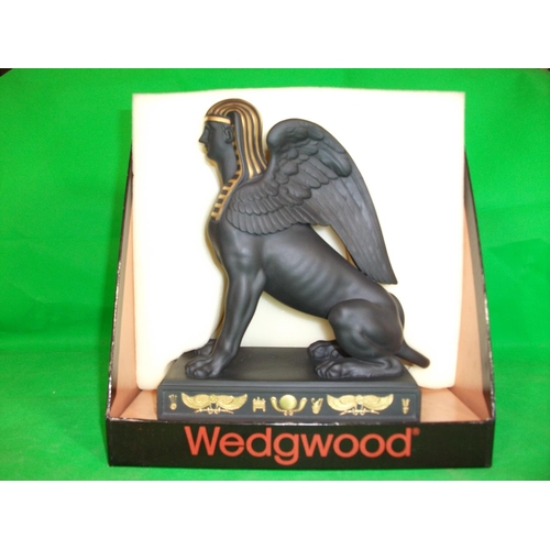 233 - WEDGEWOOD  EGYPTIAN COLLECTION SPHINX SITTING.  IN  GILDED BLACK BASALT, HEIGHT 8.75 INCHES LENGTH 7... 