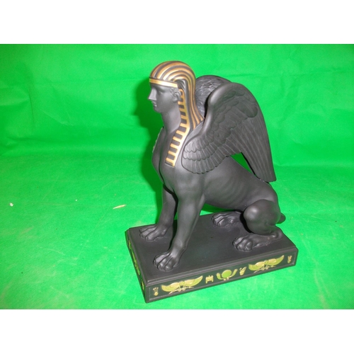 233 - WEDGEWOOD  EGYPTIAN COLLECTION SPHINX SITTING.  IN  GILDED BLACK BASALT, HEIGHT 8.75 INCHES LENGTH 7... 