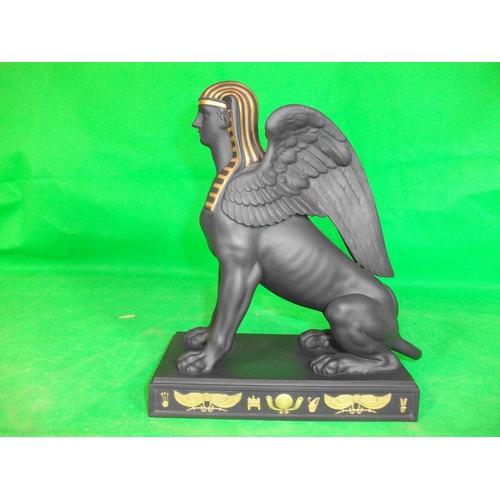 233 - WEDGEWOOD  EGYPTIAN COLLECTION SPHINX SITTING.  IN  GILDED BLACK BASALT, HEIGHT 8.75 INCHES LENGTH 7... 