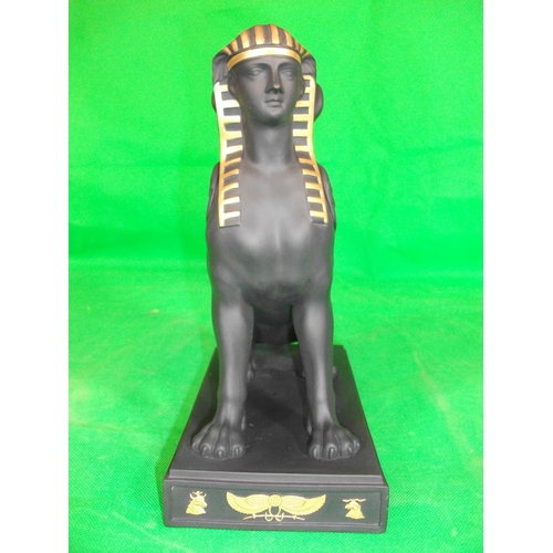 233 - WEDGEWOOD  EGYPTIAN COLLECTION SPHINX SITTING.  IN  GILDED BLACK BASALT, HEIGHT 8.75 INCHES LENGTH 7... 