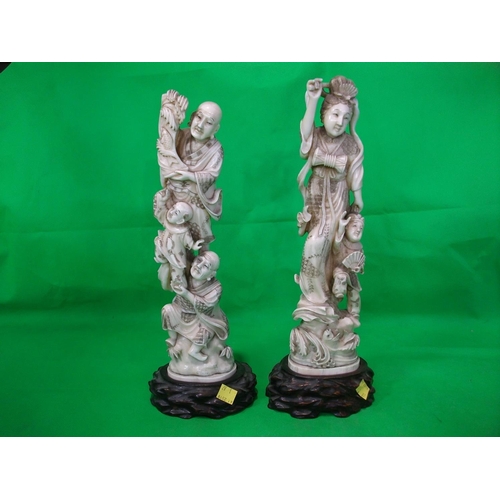 254 - PAIR OF ORIENTAL CARVED IVORY  FIGURINES WITH RAISED BASES 30CM HIGH AND 31CM HIGH