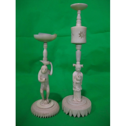 258 - TWO ORIENTAL STANDS WITH CARVED FIGURES