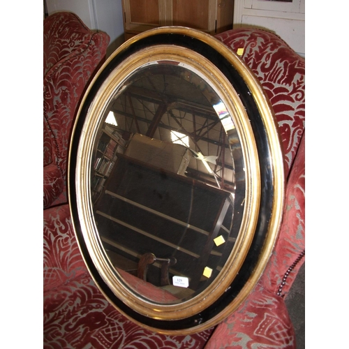 129 - PAIR OF OVAL MIRRORS (GILT & BLACK FRAMES) 29''H X 23.5''L