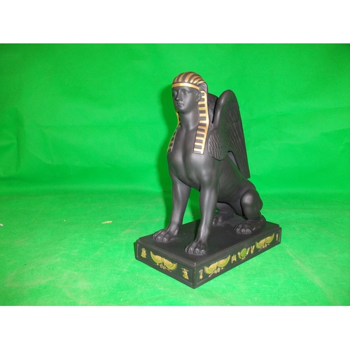 233 - WEDGEWOOD  EGYPTIAN COLLECTION SPHINX SITTING.  IN  GILDED BLACK BASALT, HEIGHT 8.75 INCHES LENGTH 7... 