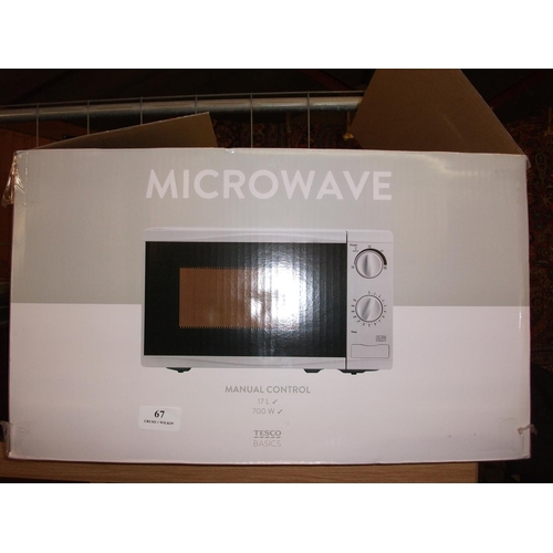 67 - TESCO MICROWAVE ( AS NEW ) WARRANTED UNTIL 12 NOON TUES FOLLOWING THE ABOVE SALE