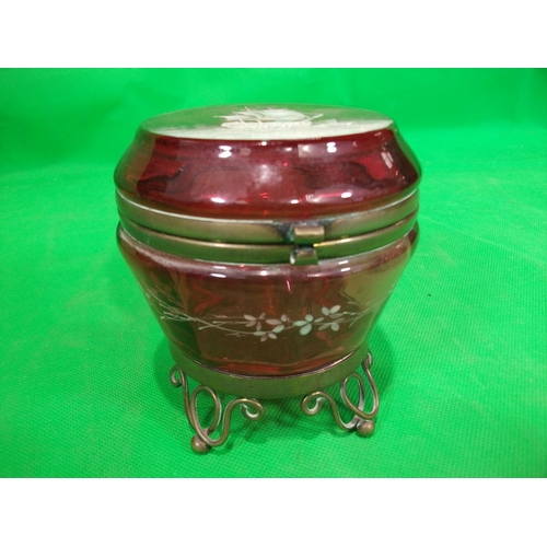 326 - CRANBERRY GLASS TRINKET BOX WITH BRASS FIXINGS AND SHIP DECORATION