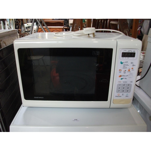 159A - MICROWAVE OVEN. WARRANTED UNTIL 12 NOON ON TUESDAY FOLLOWING THE ABOVE SALE.